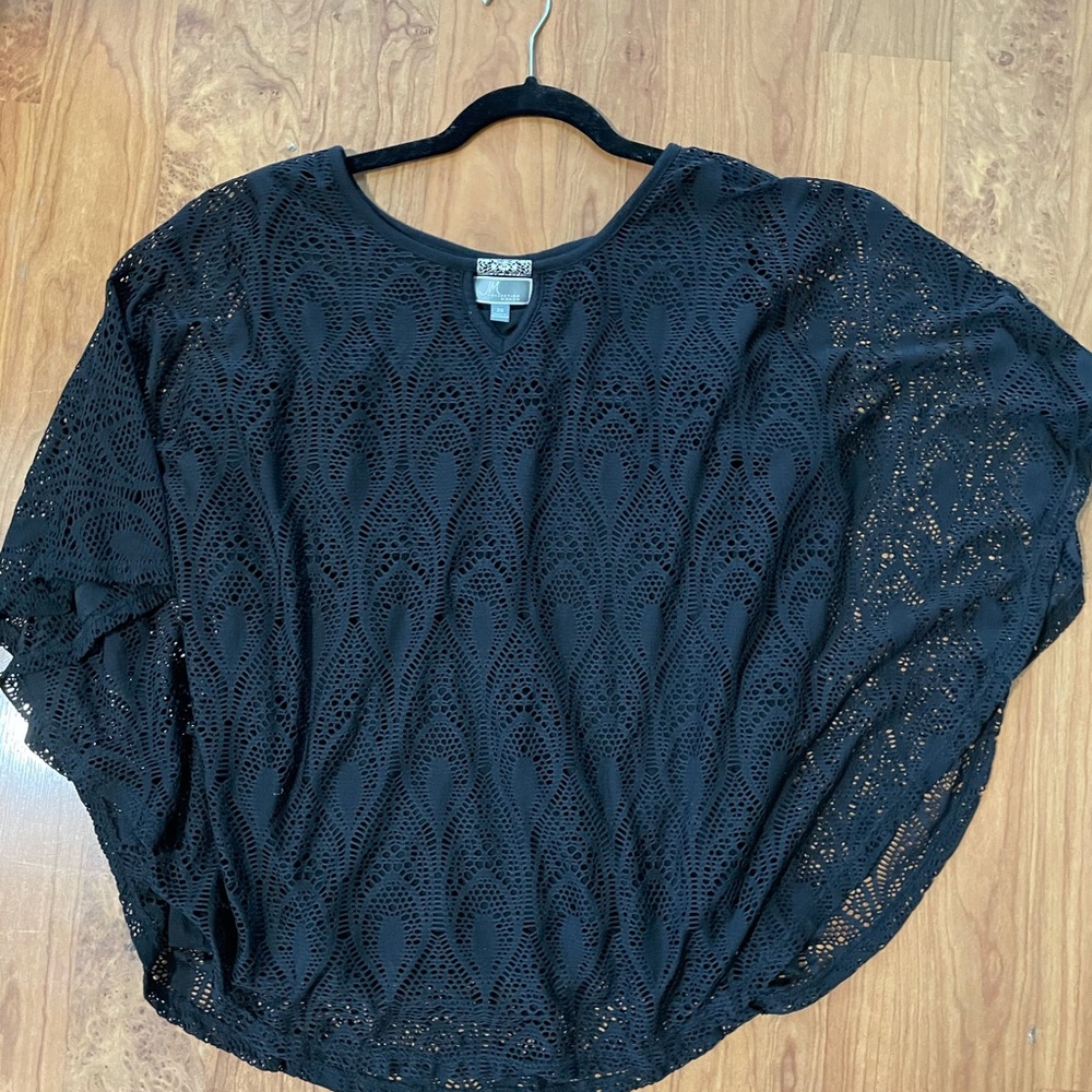 Never worn. Beautiful peacock lace design.